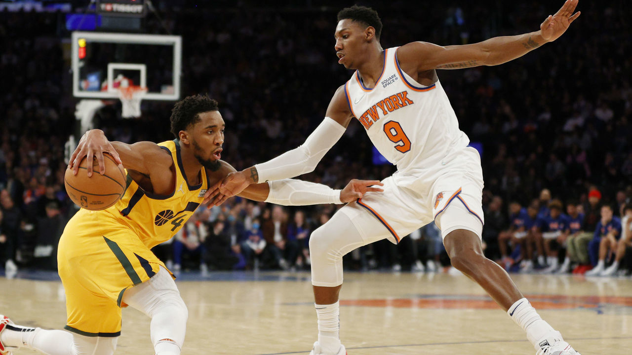 NEW YORK, NEW YORK - MARCH 20: Donovan Mitchell #45 of the Utah Jazz dribbles against RJ Barrett #9 of the New York Knicks during the second half at Madison Square Garden on March 20, 2022 in New York City. The Jazz won 108-93.