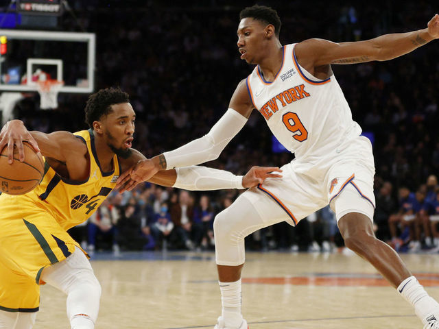 NEW YORK, NEW YORK - MARCH 20: Donovan Mitchell #45 of the Utah Jazz dribbles against RJ Barrett #9 of the New York Knicks during the second half at Madison Square Garden on March 20, 2022 in New York City. The Jazz won 108-93.
