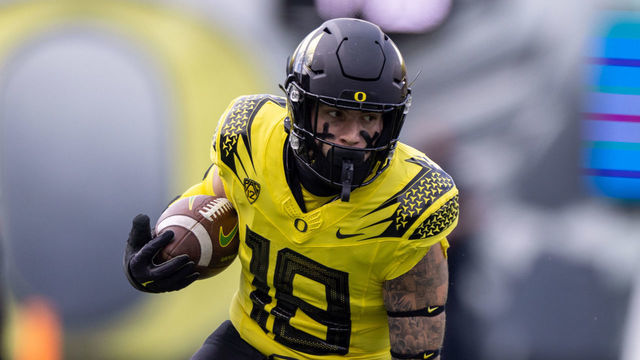 EUGENE, OR - OCTOBER 30: Spencer Webb (18) of the Oregon Ducks runs with the ball against the Colorado Buffaloes at Autzen Stadium on October 30, 2021 in Eugene, Oregon.