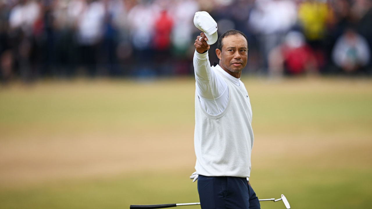 ST ANDREWS, SCOTLAND - JULY 15: Tiger Woods of the United States acknowledges the crowd on the 18th hole during Day Two of The 150th Open at St Andrews Old Course on July 15, 2022 in St Andrews, Scotland.