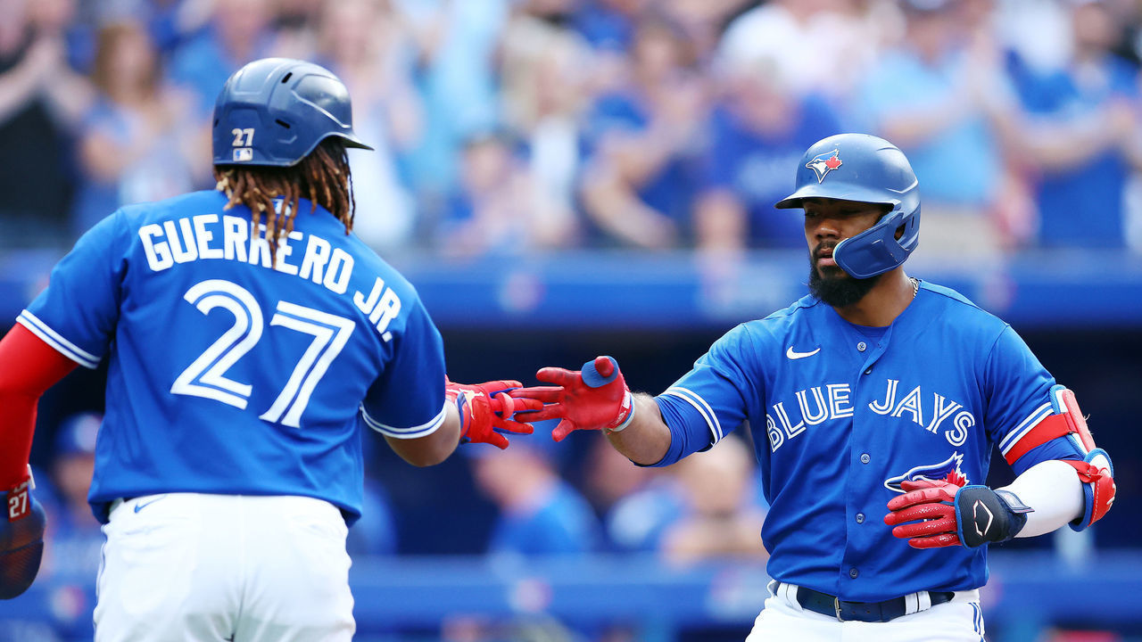 TORONTO, ON - JULY 15: Teoscar Hernandez #37 of the Toronto Blue Jays celebrates with Vladimir Guerrero Jr. #27 after hitting a 3-run home run in the third inning against the Kansas City Royals at Rogers Centre on July 15, 2022 in Toronto, Ontario, Canada.