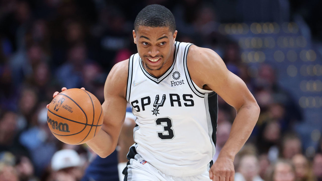DENVER, CO - APRIL 05: Keldon Johnson #3 of the San Antonio Spurs handles the ball against the Denver Nuggets during the first quarter at Ball Arena on April 5, 2022 in Denver, Colorado.