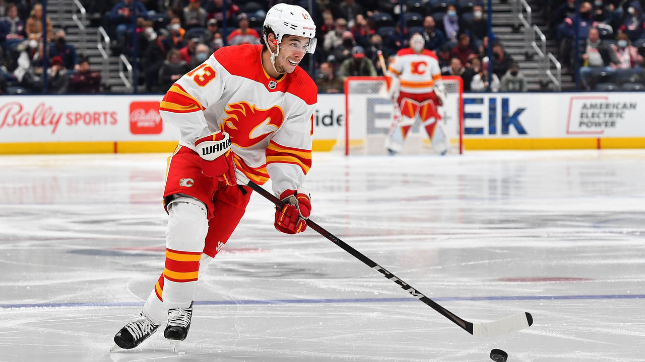COLUMBUS, OH - JANUARY 26: Johnny Gaudreau #13 of the Calgary Flames skates with the puck during the second period of a game against the Columbus Blue Jackets at Nationwide Arena on January 26, 2022 in Columbus, Ohio.