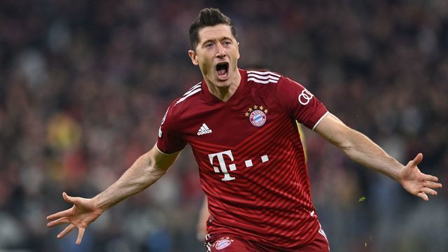 Bayern Munich's Polish forward Robert Lewandowski celebrates scoring the opening goal during the UEFA Champions League quarter-final, second leg football match FC Bayern Munich v FC Villarreal in Munich, southern Germany on April 12, 2022.
