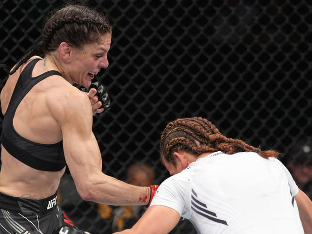 ELMONT, NEW YORK - JULY 16: (L-R) Lauren Murphy punches Miesha Tate in a flyweight fight during the UFC Fight Night event at UBS Arena on July 16, 2022 in Elmont, New York.