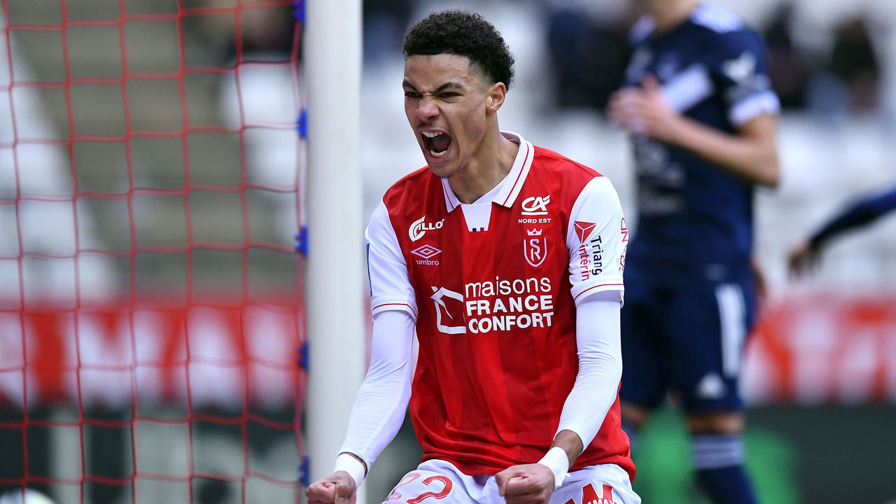 REIMS, FRANCE - FEBRUARY 06: Hugo Ekitike of Stade de Reims reacts after scoring during the Ligue 1 Uber Eats match between Reims and Bordeaux at Stade Auguste Delaune on February 06, 2022 in Reims, France.