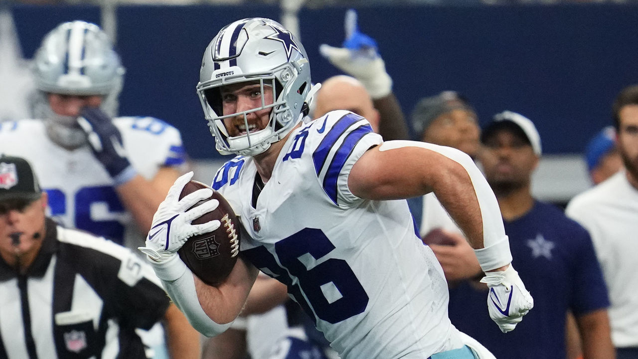 ARLINGTON, TEXAS - OCTOBER 03: Dalton Schultz #86 of the Dallas Cowboys runs the ball against the Carolina Panthers during an NFL game at AT&T Stadium on October 03, 2021 in Arlington, Texas.