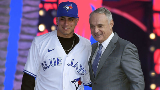 LOS ANGELES, CA - JULY 17: Brandon Barriera poses with Robert Manfred, commissioner of Major League Baseball, after he was picked 23th in the first round by the Toronto Blue Jays during the 2022 MLB Draft at XBOX Plaza on July 17, 2022 in Los Angeles, California.