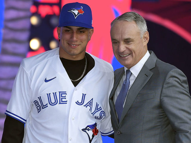 LOS ANGELES, CA - JULY 17: Brandon Barriera poses with Robert Manfred, commissioner of Major League Baseball, after he was picked 23th in the first round by the Toronto Blue Jays during the 2022 MLB Draft at XBOX Plaza on July 17, 2022 in Los Angeles, California.
