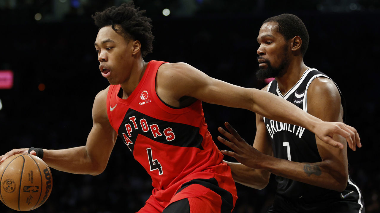 NEW YORK, NEW YORK - DECEMBER 14: Scottie Barnes #4 of the Toronto Raptors dribbles as Kevin Durant #7 of the Brooklyn Nets defends during the second half at Barclays Center on December 14, 2021 in the Brooklyn borough of New York City. The Nets won 131-129.