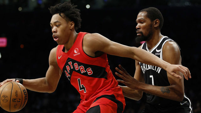 NEW YORK, NEW YORK - DECEMBER 14: Scottie Barnes #4 of the Toronto Raptors dribbles as Kevin Durant #7 of the Brooklyn Nets defends during the second half at Barclays Center on December 14, 2021 in the Brooklyn borough of New York City. The Nets won 131-129.