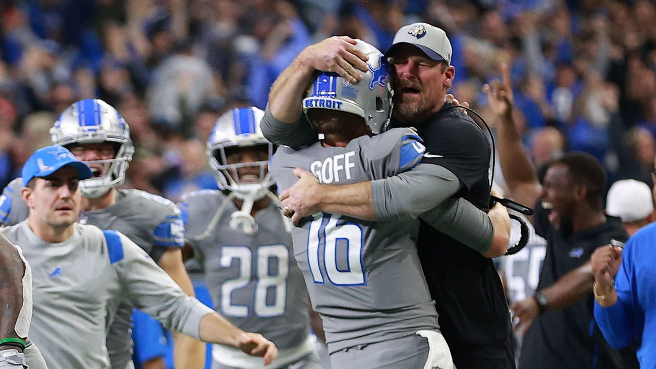 DETROIT, MICHIGAN - DECEMBER 05: Jared Goff #16 of the Detroit Lions celebrates with head coach Dan Campbell after defeating the Minnesota Vikings 29-27 to win their first game of the season at Ford Field on December 05, 2021 in Detroit, Michigan.