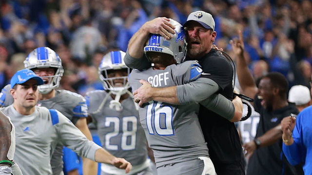 DETROIT, MICHIGAN - DECEMBER 05: Jared Goff #16 of the Detroit Lions celebrates with head coach Dan Campbell after defeating the Minnesota Vikings 29-27 to win their first game of the season at Ford Field on December 05, 2021 in Detroit, Michigan.
