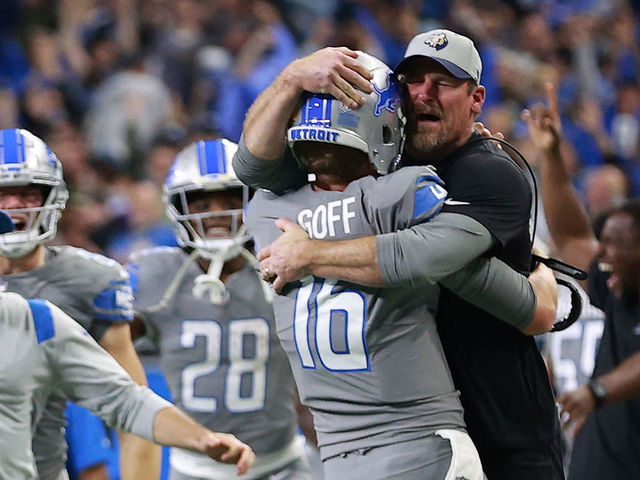 DETROIT, MICHIGAN - DECEMBER 05: Jared Goff #16 of the Detroit Lions celebrates with head coach Dan Campbell after defeating the Minnesota Vikings 29-27 to win their first game of the season at Ford Field on December 05, 2021 in Detroit, Michigan.