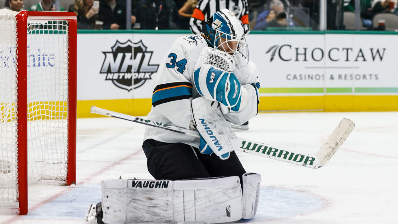 DALLAS, TX - APRIL 16: San Jose Sharks goaltender Kaapo Kahkonen (34) makes the save during the game between the Dallas Stars and the San Jose Sharks on April 16, 2022 at the American Airlines Center in Dallas, Texas.