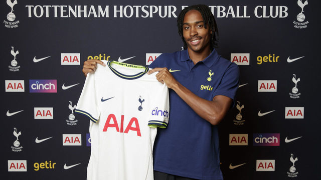 ENFIELD, ENGLAND - JULY 19: New Tottenham Hotspur signing Djed Spence poses with a shirt at Tottenham Hotspur Training Centre on July 19, 2022 in Enfield, England.