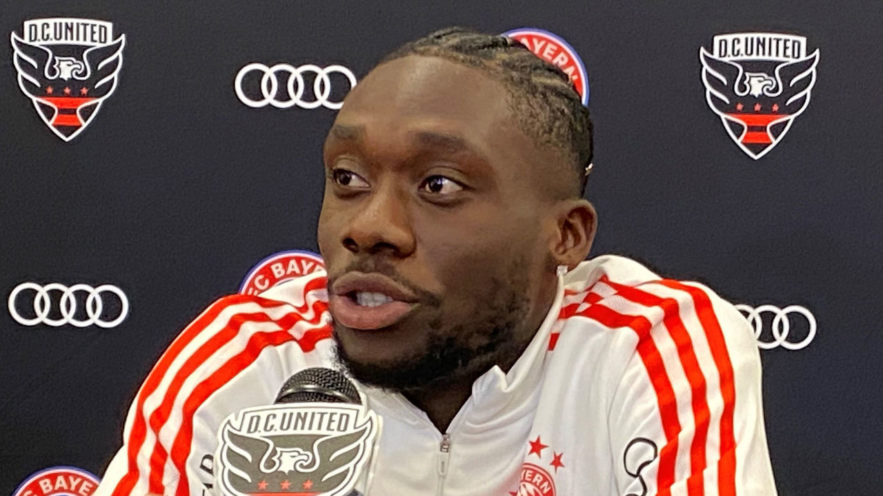 19 July 2022, US, Washington: Alphonso Davies, player of the Bundesliga team FC Bayern Munich, takes part in a press conference. FC Bayern Munich has started its tour in the USA. Photo: dpa