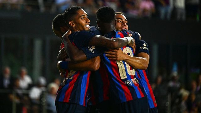FC Barcelona's forward Raphinha (L) celebrates with teammates after scoring a goal during a friendly match between Inter Miami and FC Barcelona at the DRV PNK Stadium in Fort Lauderdale, on July 19, 2022.