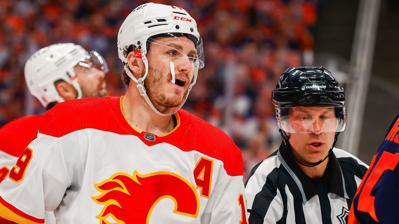 EDMONTON, AB - MAY 24: Calgary Flames Right Wing Matthew Tkachuk (19) gets pulled out of scrum action in the first period during the Edmonton Oilers versus the Calgary Flames in the Stanley Cup playoffs round 2, game 4 on May 24, 2022 at Rogers Place in Edmonton, AB.