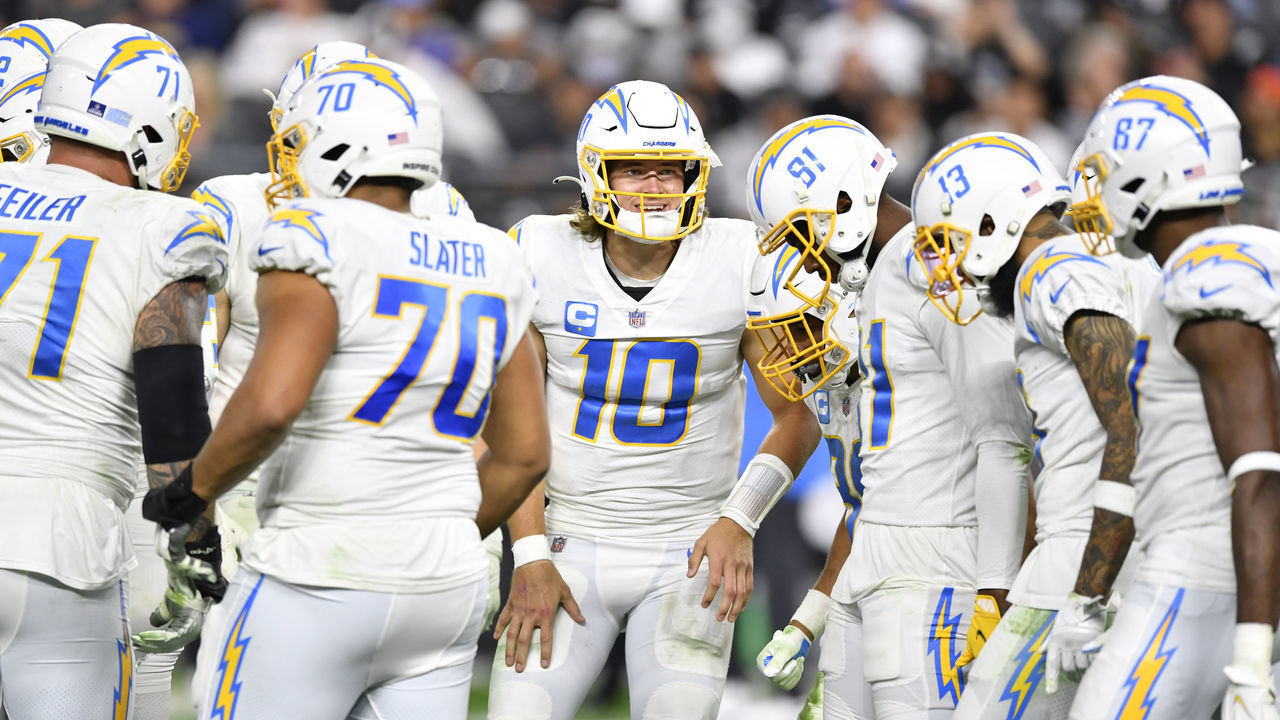 LAS VEGAS, NEVADA - JANUARY 09: Quarterback Justin Herbert #10 of the Los Angeles Chargers enters the huddle during the second half of a game against the Las Vegas Raiders at Allegiant Stadium on January 09, 2022 in Las Vegas, Nevada. The Raiders defeated the Chargers 35-32 in overtime.