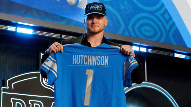LAS VEGAS, NV - APRIL 28: Aidan Hutchinson, Michigan poses with his jersey as he is selected as the overall number two draft pick by the Detroit Lions during the NFL Draft on April 28, 2022 in Las Vegas, Nevada.