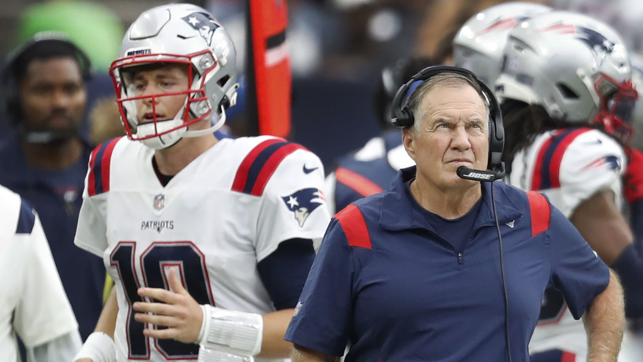 Houston, MA - October 10: Patriots quarterback Mac Jones (10) is pictured walking past head coach Bill Belichick after throwing an interception very early in the third quarter. The New England Patriots visited the Houston Texans for a regular season NFL football game at NRG Stadium in Houston, TX on Oct. 10, 2021.