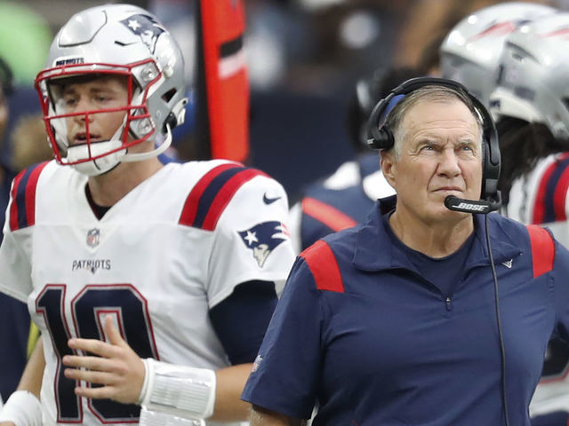 Houston, MA - October 10: Patriots quarterback Mac Jones (10) is pictured walking past head coach Bill Belichick after throwing an interception very early in the third quarter. The New England Patriots visited the Houston Texans for a regular season NFL football game at NRG Stadium in Houston, TX on Oct. 10, 2021.