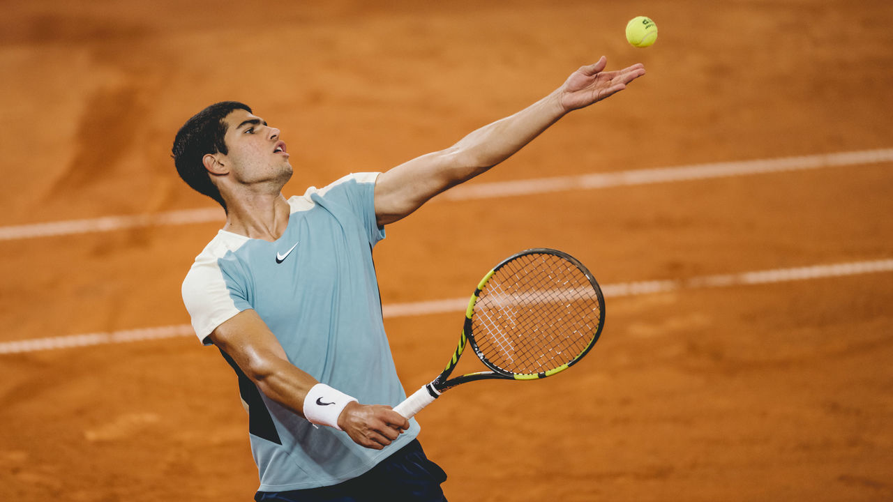 HAMBURG, GERMANY - JULY 21: (EDITOR'S NOTE: Image has been digitally enhanced) Carlos Alcaraz of Spain in action during day six of the Hamburg European Open 2022 at Rothenbaum on July 21, 2022 in Hamburg, Germany.