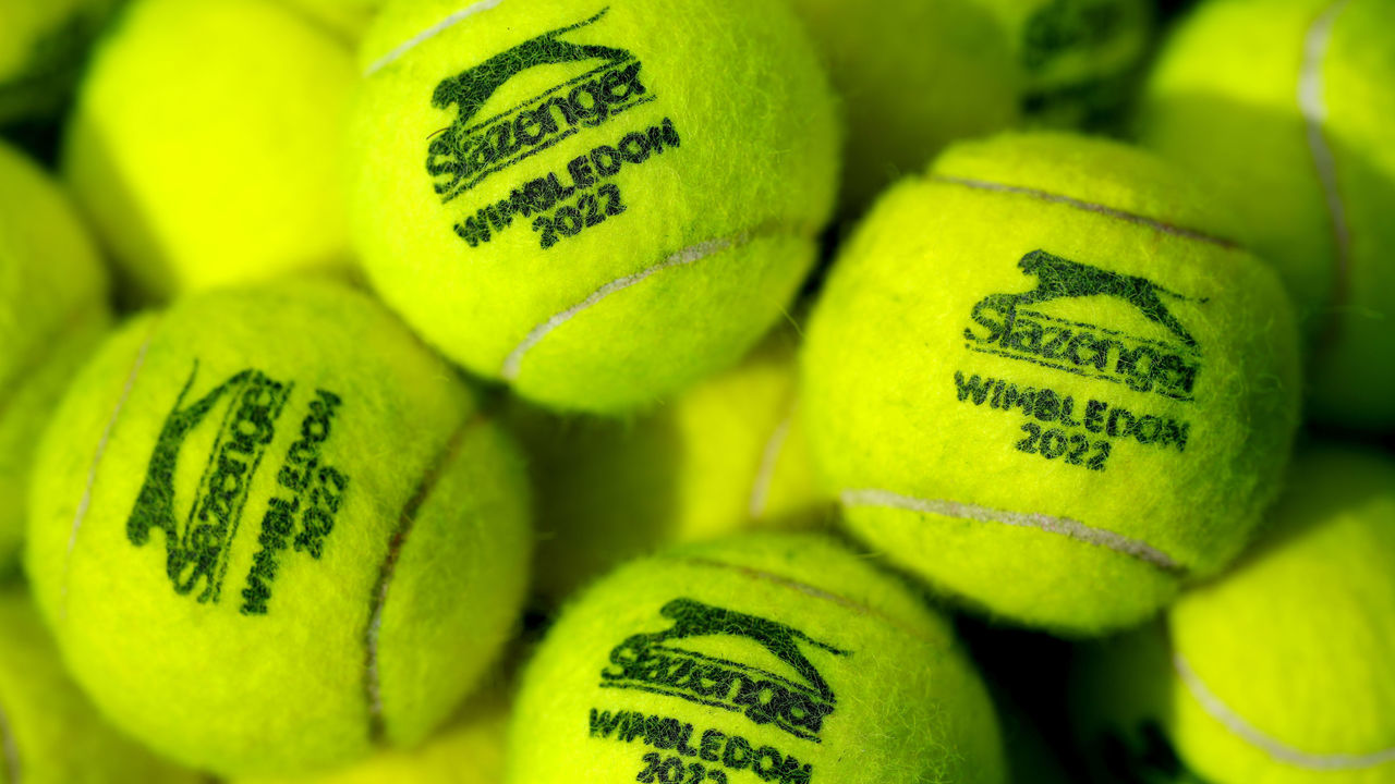 A general view of Wimbledon 2022 branded Slazenger tennis balls ahead of the 2022 Wimbledon Championship at the All England Lawn Tennis and Croquet Club, Wimbledon. Picture date: Sunday June 26, 2022.