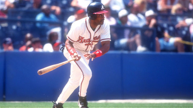 ATLANTA, GA - JULY 16: Dwight Smith #7 of the Atlanta Braves takes a swing during a baseball game against the Montreal Expos on July 16, 1996 at Fulton County Stadium in Atlanta, Georgia.