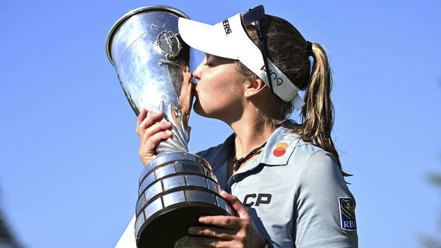 EVIAN-LES-BAINS, FRANCE - JULY 24: Brooke M. Henderson of Canada lift the trophy after winning the The Amundi Evian Championship during day four of The Amundi Evian Championship at Evian Resort Golf Club on July 24, 2022 in Evian-les-Bains, France.