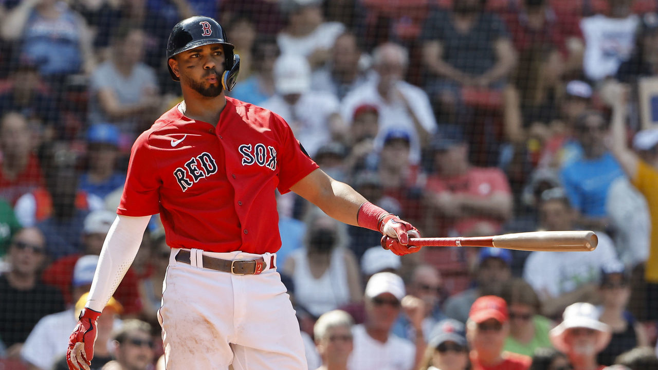 BOSTON, MA - JULY 24: As catcher Danny Jansen #9 of the Toronto Blue Jays gets up, Xander Bogaerts #2 of the Boston Red Sox reacts to striking out during the fifth inning at Fenway Park on July 24, 2022 in Boston, Massachusetts.