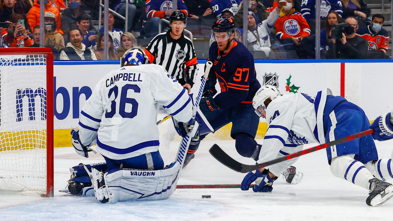 EDMONTON, AB - DECEMBER 14: Edmonton Oilers Center Connor McDavid (97) is stopped by Toronto Maple Leafs Goalie Jack Campbell (36) and Toronto Maple Leafs Defenceman Morgan Rielly (44) in the first period during the Edmonton Oilers game versus the Toronto Maple Leafs on December 14, 2021 at Rogers Place in Edmonton, AB.