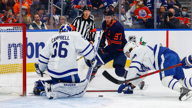 EDMONTON, AB - DECEMBER 14: Edmonton Oilers Center Connor McDavid (97) is stopped by Toronto Maple Leafs Goalie Jack Campbell (36) and Toronto Maple Leafs Defenceman Morgan Rielly (44) in the first period during the Edmonton Oilers game versus the Toronto Maple Leafs on December 14, 2021 at Rogers Place in Edmonton, AB.
