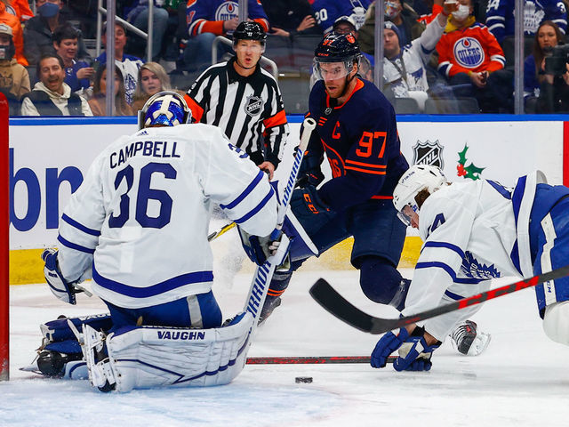EDMONTON, AB - DECEMBER 14: Edmonton Oilers Center Connor McDavid (97) is stopped by Toronto Maple Leafs Goalie Jack Campbell (36) and Toronto Maple Leafs Defenceman Morgan Rielly (44) in the first period during the Edmonton Oilers game versus the Toronto Maple Leafs on December 14, 2021 at Rogers Place in Edmonton, AB.