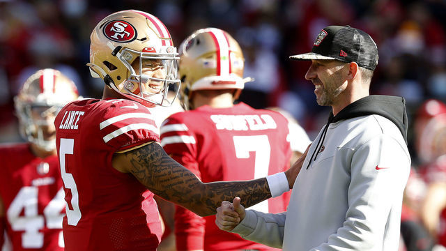 SANTA CLARA, CALIFORNIA - JANUARY 02: Trey Lance #5 of the San Francisco 49ers and Head Coach Kyle Shanahan of the San Francisco 49ers talk before the game against the Houston Texans at Levi's Stadium on January 02, 2022 in Santa Clara, California.