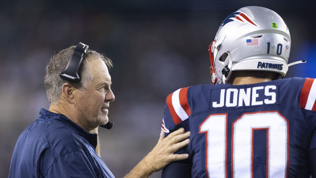 PHILADELPHIA, PA - AUGUST 19: Head coach Bill Belichick of the New England Patriots talks to Mac Jones #10 against the Philadelphia Eagles in the first half of the preseason game at Lincoln Financial Field on August 19, 2021 in Philadelphia, Pennsylvania. The Patriots defeated the Eagles 35-0.