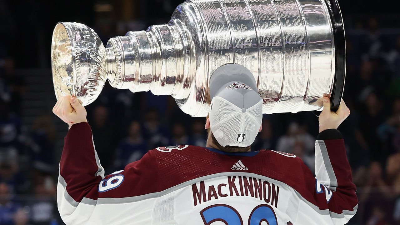 TAMPA, FLORIDA - JUNE 26: Nathan MacKinnon #29 of the Colorado Avalanche kisses the Stanley Cup in celebration after Game Six of the 2022 NHL Stanley Cup Final at Amalie Arena on June 26, 2022 in Tampa, Florida. The Avalanche defeated the Lightning 2-1.
