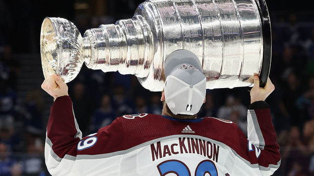 TAMPA, FLORIDA - JUNE 26: Nathan MacKinnon #29 of the Colorado Avalanche kisses the Stanley Cup in celebration after Game Six of the 2022 NHL Stanley Cup Final at Amalie Arena on June 26, 2022 in Tampa, Florida. The Avalanche defeated the Lightning 2-1.