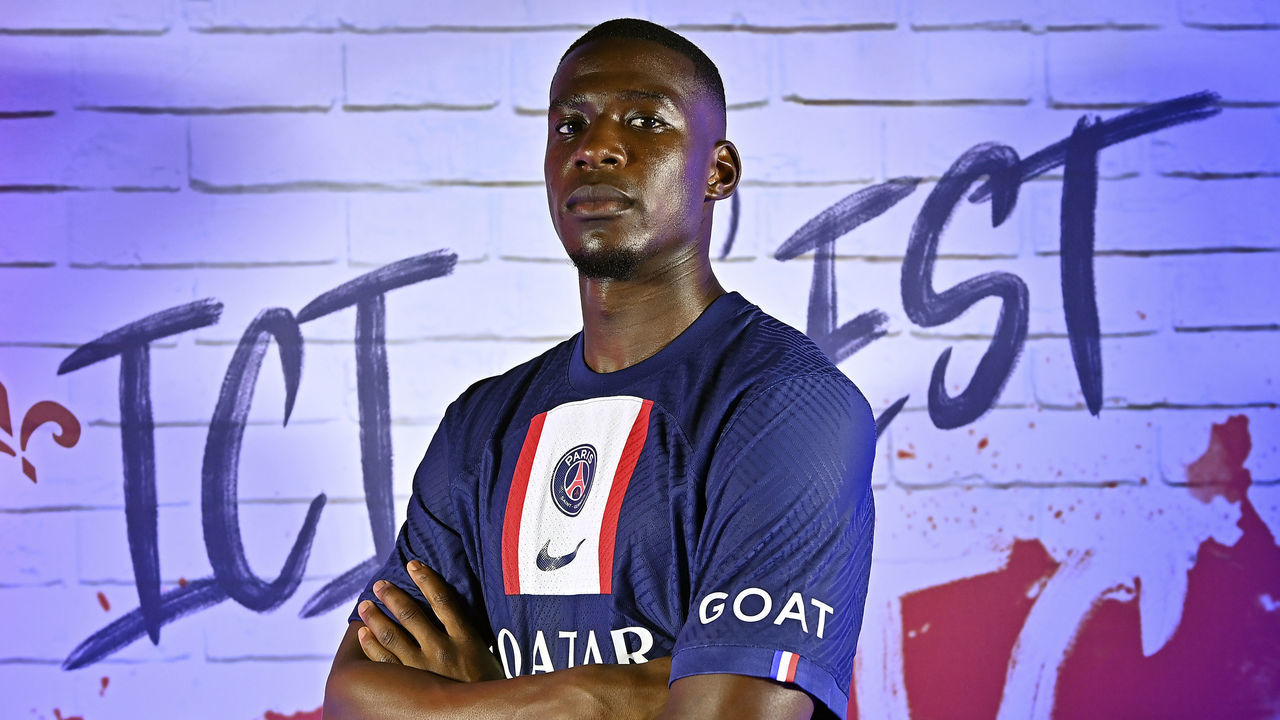 BOULOGNE-BILLANCOURT, FRANCE - JULY 26: Nordi Mukiele poses with his new jersey after signing a 5 year contract with Paris Saint-Germai on July 26, 2022 in Boulogne-Billancourt, France.
