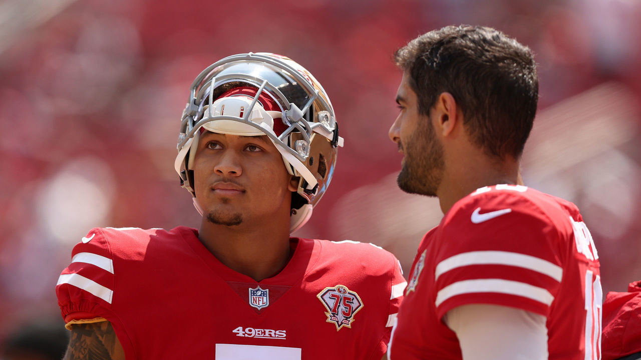SANTA CLARA, CALIFORNIA - AUGUST 29: Jimmy Garoppolo #10 and Trey Lance #5 of the San Francisco 49ers talk to each other on the sidelines before their preseason game against the Las Vegas Raiders at Levi's Stadium on August 29, 2021 in Santa Clara, California.