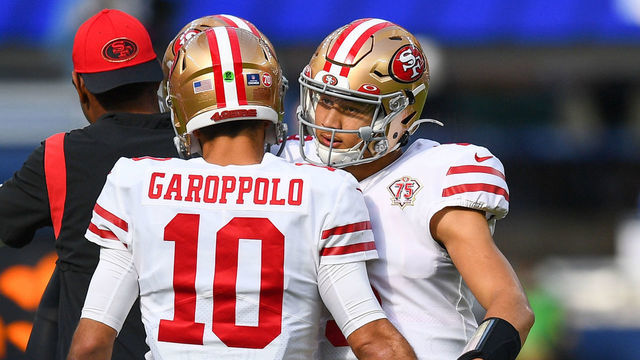 INGLEWOOD, CA - JANUARY 09: San Francisco 49ers Quarterback Jimmy Garoppolo (10) hugs San Francisco 49ers Quarterback Trey Lance (5) before the NFL game between the San Francisco 49ers and the Los Angeles Rams on January 9, 2022, at SoFi Stadium in Inglewood, CA.
