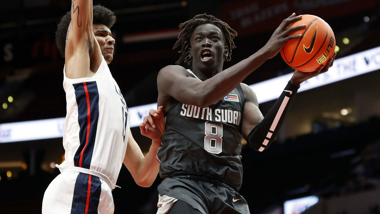 PORTLAND, OREGON - APRIL 08: Omaha Biliew #8 of World Team shoots against Kel'el Ware #11 of USA Team in the third quarter during the Nike Hoop Summit at Moda Center on April 08, 2022 in Portland, Oregon.