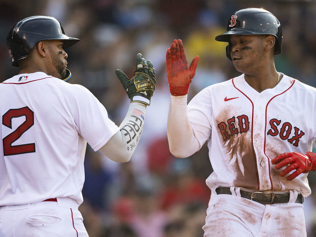 Rafael Devers of the Boston Red Sox reacts after hitting a single News  Photo - Getty Images