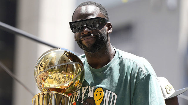 SAN FRANCISCO, CALIFORNIA - JUNE 20: Draymond Green #23 of the Golden State Warriors celebrates with the NBA Championship Trophy during the Golden State Warriors Victory Parade on June 20, 2022 in San Francisco, California. The Golden State Warriors beat the Boston Celtics 4-2 to win the 2022 NBA Finals.