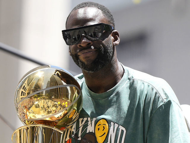 SAN FRANCISCO, CALIFORNIA - JUNE 20: Draymond Green #23 of the Golden State Warriors celebrates with the NBA Championship Trophy during the Golden State Warriors Victory Parade on June 20, 2022 in San Francisco, California. The Golden State Warriors beat the Boston Celtics 4-2 to win the 2022 NBA Finals.
