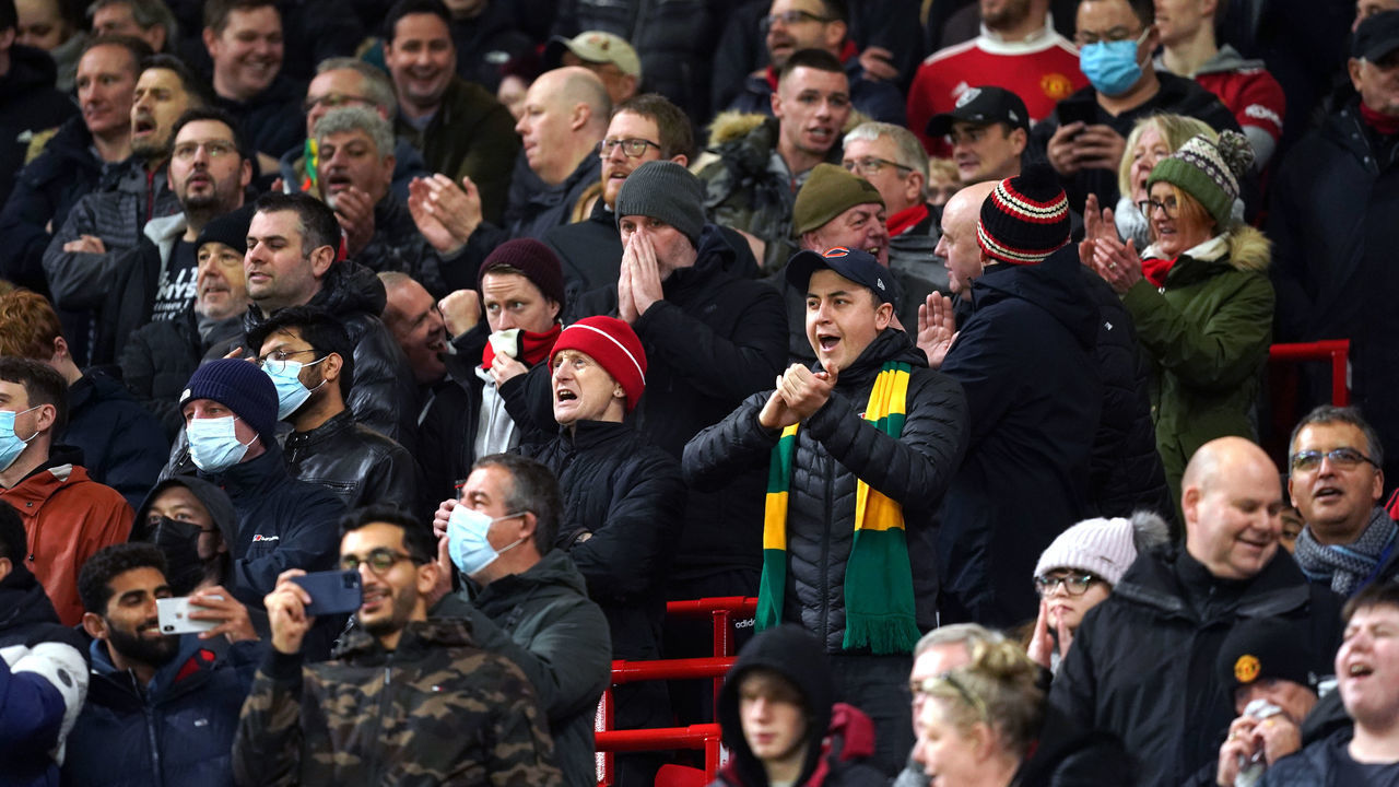 Fans in the newly built safe-standing section during the Premier League match at Old Trafford, Manchester. Picture date: Monday January 3, 2022.