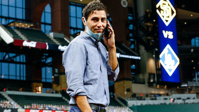 ARLINGTON, TX - OCTOBER 06: A.J. Preller, president of baseball operations for the San Diego Padres talks on his phone prior to Game 1 of the NLDS between the Los Angeles Dodgers and the San Diego Padres at Globe Life Field on Tuesday, October 6, 2020 in Arlington, Texas.