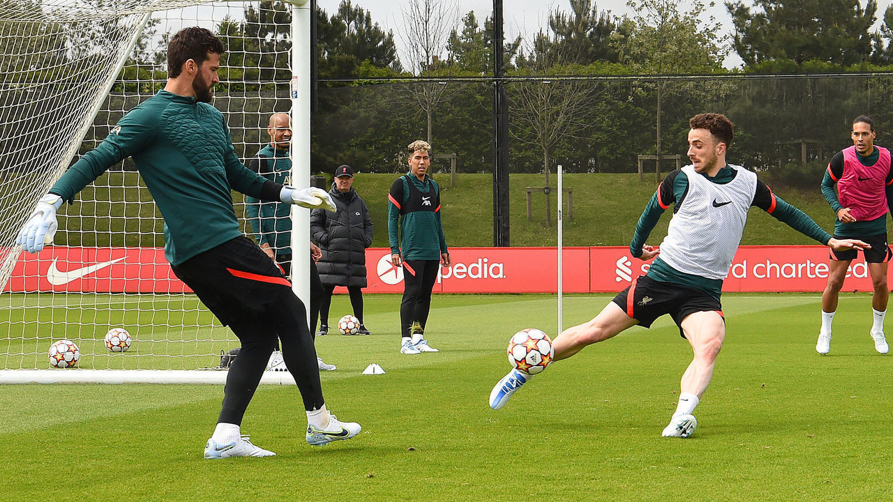 KIRKBY, ENGLAND - MAY 25: (THE SUN OUT. THE SUN ON SUNDAY OUT) Alisson Becker and Diogo Jota of Liverpool during a training session at AXA Training Centre on May 25, 2022 in Kirkby, England.
