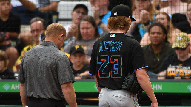 PITTSBURGH, PA - JULY 23: Max Meyer #23 of the Miami Marlins walks to the dugout with a trainer after leaving the game against the Pittsburgh Pirates with an apparent injury in the first inning at PNC Park on July 23, 2022 in Pittsburgh, Pennsylvania.